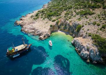 Enjoy the pristine nature of three islands on a wooden sailing boat